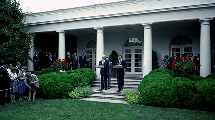 Russian President Boris Yeltsin and US President George HW Bush speak at the White House Rose Garden to announce an agreement to sharply reduce both countries’ strategic nuclear arsenals. Washington, DC, June 16, 1992. (Photo by Mark Reinstein/Corbis via Getty Images) 